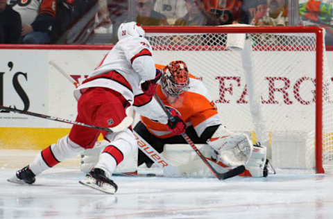 PHILADELPHIA, PA – NOVEMBER 05: Carter Hart #79 of the Philadelphia Flyers makes a stick save against Sebastian Aho #20 of the Carolina Hurricanes on November 5, 2019 at the Wells Fargo Center in Philadelphia, Pennsylvania. (Photo by Len Redkoles/NHLI via Getty Images)