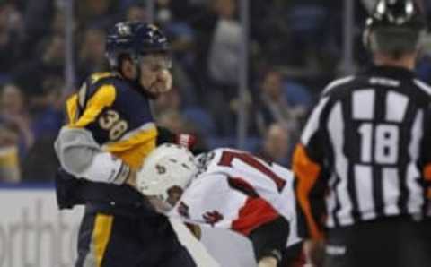 Feb 10, 2015; Buffalo, NY, USA; Buffalo Sabres right wing Patrick Kaleta (36) fights with Ottawa Senators defenseman Mark Borowiecki (74) during the second period at First Niagara Center. Mandatory Credit: Kevin Hoffman-USA TODAY Sports