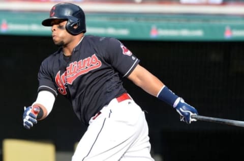 Jun 5, 2016; Cleveland, OH, USA; Cleveland Indians first baseman Carlos Santana (41) hits and RBI single during the seventh inning against the Kansas City Royals at Progressive Field. The Indians won 7-0. Mandatory Credit: Ken Blaze-USA TODAY Sports