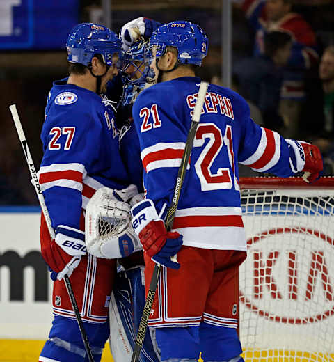 Nov 1, 2016; New York, NY, USA; New York Rangers goalie Henrik Lundqvist (30) celebrates with New York Rangers defenseman Ryan McDonagh (27) and New York Rangers center Derek Stepan (21) after defeating the St. Louis Blues at Madison Square Garden. Mandatory Credit: Adam Hunger-USA TODAY Sports.