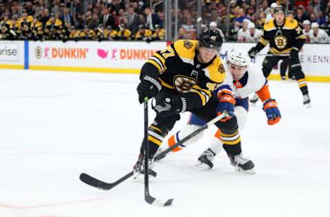 BOSTON, MASSACHUSETTS – DECEMBER 19: Adam Pelech #3 of the New York Islanders defends Torey Krug #47 of the Boston Bruins during the third period at TD Garden on December 19, 2019 in Boston, Massachusetts. (Photo by Maddie Meyer/Getty Images)