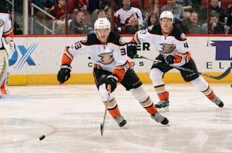 GLENDALE, AZ – FEBRUARY 20: Jakob Silfverberg #33 of the Anaheim Ducks skates for a loose puck ahead of teammate Hampus Lindholm #47 during third-period action against the Arizona Coyotes at Gila River Arena on February 20, 2017, in Glendale, Arizona. (Photo by Norm Hall/NHLI via Getty Images)