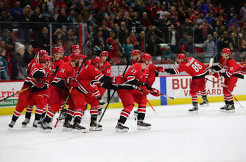 RALEIGH, NC – DECEMBER 05: Carolina Hurricanes celebrate a win at the end of the OT period of the Carolina Hurricanes game versus the New York Rangers on December 5th, 2019 at PNC Arena in Raleigh, NC (Photo by Jaylynn Nash/Icon Sportswire via Getty Images)