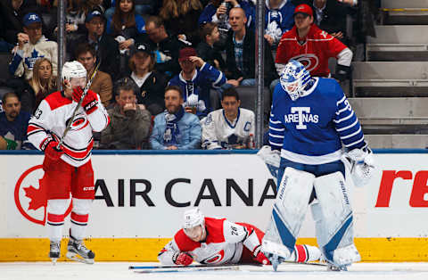 TORONTO, ON – DECEMBER 19: Frederik Andersen #31 of the Toronto Maple Leafs looks down at Elias Lindholm #28 and Brock McGinn #23 of the Carolina Hurricanes during the third period at the Air Canada Centre on December 19, 2017 in Toronto, Ontario, Canada. (Photo by Mark Blinch/NHLI via Getty Images)