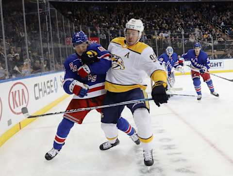 NEW YORK, NEW YORK – DECEMBER 16: Ryan Lindgren #55 of the New York Rangers and Ryan Johansen #92 of the Nashville Predators battle for position during the first period at Madison Square Garden on December 16, 2019 in New York City. (Photo by Bruce Bennett/Getty Images)