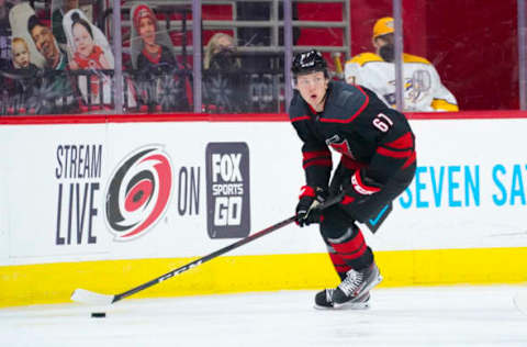 Mar 11, 2021; Raleigh, North Carolina, USA; Carolina Hurricanes forward Morgan Geekie (67) skates with the puck against the Nashville Predators at PNC Arena. Mandatory Credit: James Guillory-USA TODAY Sports