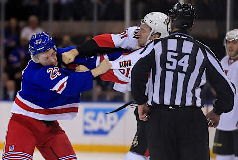 Dec 27, 2016; New York, NY, USA; Ottawa Senators right wing Mark Stone (61) punches New York Rangers left wing Jimmy Vesey (26) during the third period at Madison Square Garden. Mandatory Credit: Adam Hunger-USA TODAY Sports