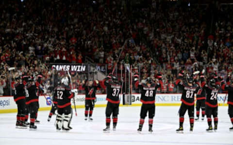 RALEIGH, NORTH CAROLINA – MAY 04: The Carolina Hurricanes perform their Storm Surge at center ice after a win against the Boston Bruins in Game Two of the First Round of the 2022 Stanley Cup Playoffs at PNC Arena on May 04, 2022 in Raleigh, North Carolina. The Hurricanes won 5-2. (Photo by Grant Halverson/Getty Images)