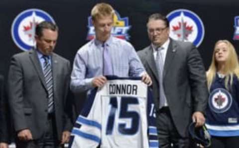 Jun 26, 2015; Sunrise, FL, USA; Kyle Connor holds his jersey after being selected as the number seventeen overall pick to the Winnipeg Jets in the first round of the 2015 NHL Draft at BB&T Center. Mandatory Credit: Steve Mitchell-USA TODAY Sports