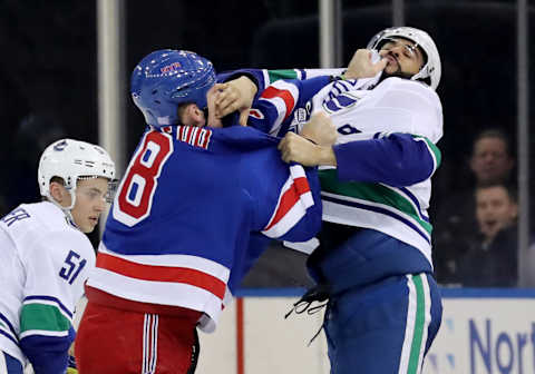 NEW YORK, NEW YORK – NOVEMBER 12: Cody McLeod #8 of the New York Rangers and Darren Archibald #49 of the Vancouver Canucks fight in the second period at Madison Square Garden on November 12, 2018 in New York City. (Photo by Elsa/Getty Images)