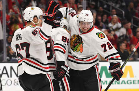 Apr 8, 2017; Los Angeles, CA, USA; Chicago Blackhawks left wing Artemi Panarin (72), right wing Patrick Kane (88) and center Tanner Kero (67) celebrate a goal in the third period of the game against the Los Angeles Kings at Staples Center. Kings won 3-2 in overtime. Mandatory Credit: Jayne Kamin-Oncea-USA TODAY Sports