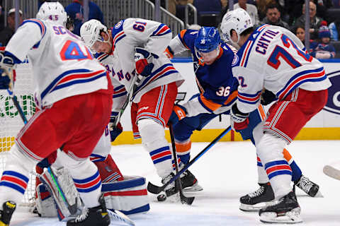 Apr 21, 2022; Elmont, New York, USA; New York Islanders left wing Otto Koivula (36) and New York Rangers defenseman Justin Braun (61) battle for a loose puck in front of New York Rangers goaltender Alexandar Georgiev (40) during the second period at UBS Arena. Mandatory Credit: Dennis Schneidler-USA TODAY Sports