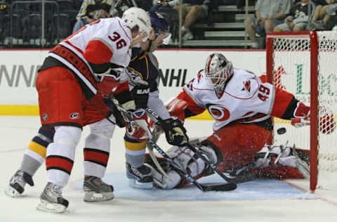 NASHVILLE, TN – SEPTEMBER 26: Forward J.P.Dumont of the Nashville Predators skates through the defense of forward Jussi Jokinen #36 of the Carolina Hurricanes and scores a goal against Hurricanes goalie Michael Leighton #49 during a pre-season NHL game at the Sommet Center on September 26, 2009 in Nashville, Tennessee. (Photo by Frederick Breedon/Getty Images)