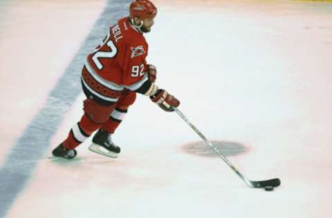 DETROIT, MI – JUNE 13: Right wing Jeff O’Neill #92 of the Carolina Hurricanes skates with the puck against the Detroit Red Wings in game five of the NHL Stanley Cup Finals on June 13, 2002 at the Joe Louis Arena in Detroit, Michigan. The Red Wings won the game 3-1 and the series 4-1. (Photo by Harry How/Getty Images/NHLI)