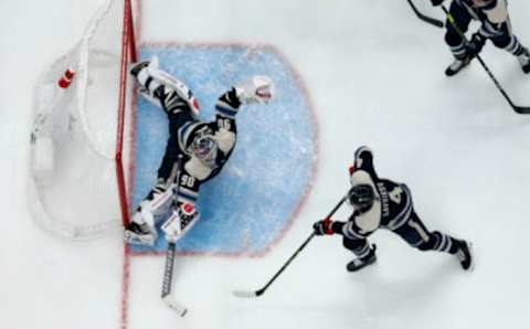 Oct 28, 2022; Columbus, Ohio, USA; Columbus Blue Jackets goalie Elvis Merzlikins (90) stretches out to make a save against the Boston Bruins during the first period at Nationwide Arena. Mandatory Credit: Russell LaBounty-USA TODAY Sports