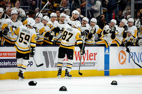 COLUMBUS, OHIO – NOVEMBER 14: Sidney Crosby #87 of the Pittsburgh Penguins is congratulated by his teammates after scoring his third goal of the game and recording a hat-trick during the third period against the Columbus Blue Jackets at Nationwide Arena on November 14, 2023 in Columbus, Ohio. Pittsburgh defeated Columbus 5-3. (Photo by Kirk Irwin/Getty Images)