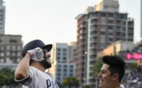 SAN DIEGO, CA – JULY 14: Eric Hosmer #30 (L) of the San Diego Padres is congratulated by Christian Villanueva #22 after hitting a two-run home run during the first inning of a baseball game against the Chicago Cubs at PETCO Park on July 14, 2018 in San Diego, California. (Photo by Denis Poroy/Getty Images)