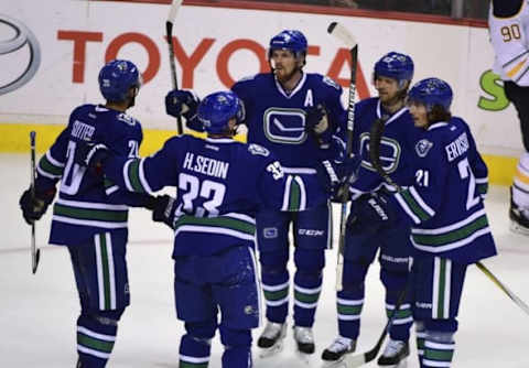 NHL Team Name Origins: Vancouver Canucks forward Daniel Sedin (22) celebrates his goal against Buffalo Sabres goaltender Robin Lehner (40) during the third period at Rogers Arena. The Vancouver Canucks won 2-1. Mandatory Credit: Anne-Marie Sorvin-USA TODAY Sports