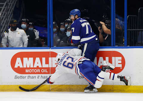 Jun 28, 2021; Tampa, Florida, USA; Montreal Canadiens left wing Artturi Lehkonen (62) falls while chasing the puck with Tampa Bay Lightning defenseman Victor Hedman (77) in the first period of game one of the 2021 Stanley Cup Final at Amalie Arena. Mandatory Credit: Kim Klement-USA TODAY Sports