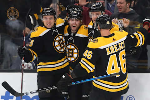 BOSTON, MASSACHUSETTS – JANUARY 09: Jake DeBrusk #74 of the Boston Bruins celebrates with Charlie McAvoy #73, Charlie Coyle #13 and David Krejci #46 after scoring a goal against the Winnipeg Jets during the third period at TD Garden on January 09, 2020 in Boston, Massachusetts. The Bruins defeat the Jets 5-4. (Photo by Maddie Meyer/Getty Images)