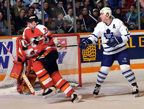 TORONTO, ON – MARCH 4: Frantisek Musil #3 of the Calgary Flames skates against Dave Andreychuk #14 of the Toronto Maple Leafs . (Photo by Graig Abel/Getty Images)