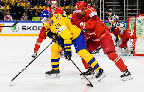 Belarus’ Yegor Sharangovich (R) and Sweden’s Lias Andersson fight for the puck during the 2018 IIHF Men’s Ice Hockey World Championship match between Sweden and Belarus on May 4, 2018 in Copenhagen. (Photo by Jonathan NACKSTRAND / AFP) (Photo credit should read JONATHAN NACKSTRAND/AFP/Getty Images)