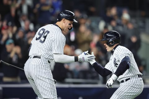 Oct 23, 2022; Bronx, New York, USA; New York Yankees center fielder Harrison Bader (22) celebrates with center fielder Aaron Judge (99) after hitting a home run in the sixth inning during game four of the ALCS for the 2022 MLB Playoffs at Yankee Stadium. Mandatory Credit: Brad Penner-USA TODAY Sports