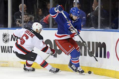 Sep 29, 2016; New York, NY, USA; New York Rangers right wing Nicklas Jensen (39) and New Jersey Devils defenseman Andy Greene (6) chase a puck into the corner during the third period of a preseason hockey game at Madison Square Garden. Mandatory Credit: Brad Penner-USA TODAY Sports