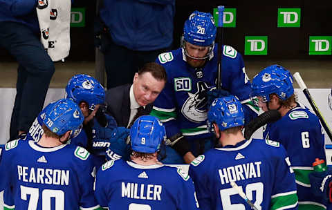 EDMONTON, ALBERTA – AUGUST 17: Vancouver Canucks assistant coach Newell Brown handles the bench during the game. (Photo by Jeff Vinnick/Getty Images)