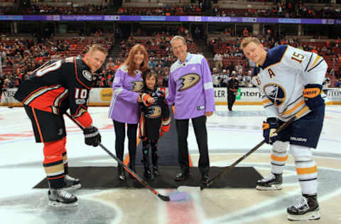 ANAHEIM, CA – OCTOBER 15: Owners of the Anaheim Ducks, Henry and Susan Samueli join Corey Perry #10 of the Anaheim Ducks and Jack Eichel #15 of the Buffalo Sabres in honoring the Jessie Rees Foundation’s Courageous Kid, Havana Achten during the ceremonial puck drop prior to the game on October 15, 2017 at Honda Center in Anaheim, California. (Photo by Debora Robinson/NHLI via Getty Images)