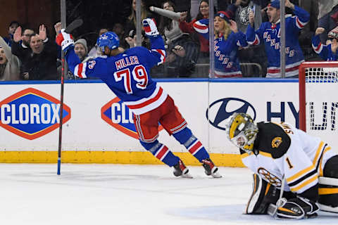 Feb 15, 2022; New York, New York, USA; New York Rangers defenseman K’Andre Miller (79) scores the game winning goal past Boston Bruins goaltender Jeremy Swayman (1) during shoots outs at Madison Square Garden. Mandatory Credit: Dennis Schneidler-USA TODAY Sports