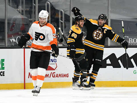 Apr 5, 2021; Boston, Massachusetts, USA; Boston Bruins center Patrice Bergeron (37) celebrates with right wing David Pastrnak (88) after scoring against the Philadelphia Flyers during the second period at the TD Garden. Mandatory Credit: Brian Fluharty-USA TODAY Sports