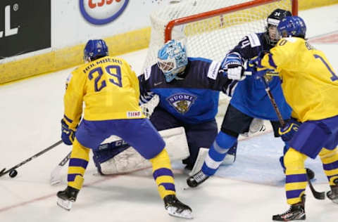 VICTORIA , BC – DECEMBER 26: Ukko-Pekka Luukkonen #1 of Finland attempts to make a save on Pontus Holmberg #29 of Sweden at the IIHF World Junior Championships at the Save-on-Foods Memorial Centre on December 26, 2018 in Victoria, British Columbia, Canada. (Photo by Kevin Light/Getty Images)