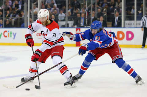 NEW YORK, NY – JANUARY 15: Carolina Hurricanes Defenceman Jaccob Slavin (74) battles with New York Rangers Center Mika Zibanejad (93) during the second period of the National Hockey League game between the Carolina Hurricanes and the New York Rangers on January 15, 2019 at Madison Square Garden in New York, NY. (Photo by Joshua Sarner/Icon Sportswire via Getty Images)