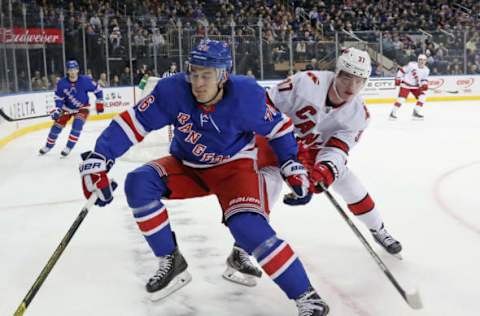 NEW YORK, NEW YORK – NOVEMBER 27: Andrei Svechnikov #37 of the Carolina Hurricanes checks Brady Skjei #76 of the New York Rangers during the first period at Madison Square Garden on November 27, 2019 in New York City. (Photo by Bruce Bennett/Getty Images)