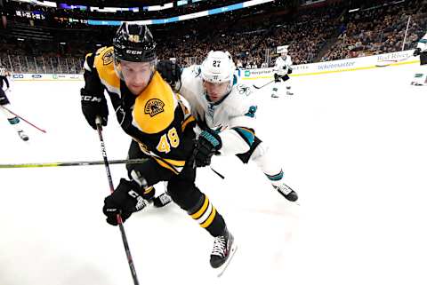 BOSTON, MA – FEBRUARY 26: San Jose Sharks right wing Joonas Donskoi (27) checks Boston Bruins left defenseman Matt Grzelcyk (48) during a game between the Boston Bruins and the San Jose Sharks on February 26, 2019, at TD Garden in Boston, Massachusetts. (Photo by Fred Kfoury III/Icon Sportswire via Getty Images)