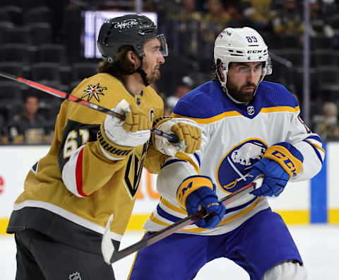 LAS VEGAS, NEVADA – FEBRUARY 01: Mark Stone #61 of the Vegas Golden Knights and Alex Tuch #89 of the Buffalo Sabres vie for the puck off a faceoff in the third period of their game at T-Mobile Arena on February 1, 2022 in Las Vegas, Nevada. The Golden Knights defeated the Sabres 5-2. (Photo by Ethan Miller/Getty Images)