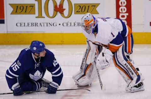 Feb 14, 2017; Toronto, Ontario, CAN; New York Islanders goaltender Thomas Greiss (1) talks to Toronto Maple Leafs forward Matt Martin (15) during warm ups prior to their game at the Air Canada Centre. Mandatory Credit: John E. Sokolowski-USA TODAY Sports