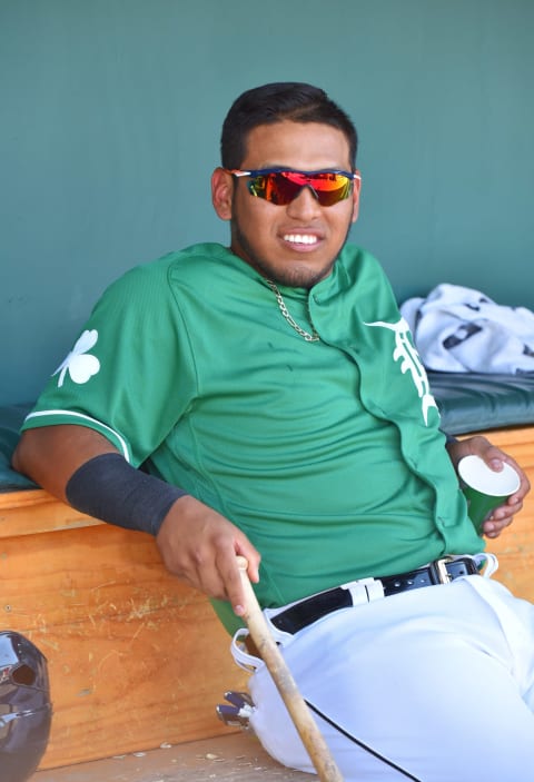 LAKELAND, FL – MARCH 17: Isaac Paredes #90 of the Detroit Tigers looks on from the dugout while wearing a green jersey to honor St. Patricks Day during the Spring Training game against the New York Yankees at Publix Field at Joker Marchant Stadium on March 17, 2018 in Lakeland, Florida. The Tigers defeated the Yankees 9-3. (Photo by Mark Cunningham/MLB Photos via Getty Images)