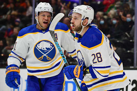 Oct 28, 2021; Anaheim, California, USA; Buffalo Sabres center Zemgus Girgensons (28) celebrates with right wing Kyle Okposo (21) his goal scored against the Anaheim Ducks during the first period at Honda Center. Okposo provided an assist on the goal. Mandatory Credit: Gary A. Vasquez-USA TODAY Sports