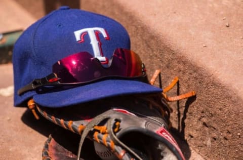 Jun 13, 2015; Arlington, TX, USA; A view a Texas Rangers baseball hat and glove during the game between the Texas Rangers and the Minnesota Twins at Globe Life Park in Arlington. The Rangers defeated the Twins 11-7. Mandatory Credit: Jerome Miron-USA TODAY Sports