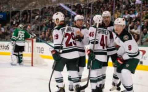 Jan 24, 2017; Dallas, TX, USA; Minnesota Wild right wing Jason Pominville (29), defenseman Jared Spurgeon (46) and center Mikko Koivu (9) celebrate a goal against the Dallas Stars during the second period at the American Airlines Center. Mandatory Credit: Jerome Miron-USA TODAY Sports