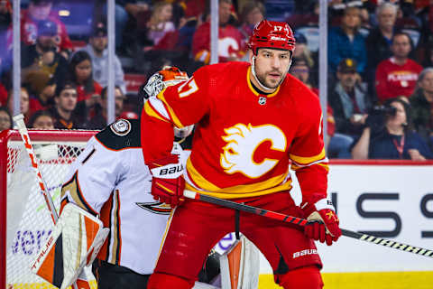 Apr 2, 2023; Calgary, Alberta, CAN; Calgary Flames left wing Milan Lucic (17) screens in front of Anaheim Ducks goaltender Lukas Dostal (1) during the second period at Scotiabank Saddledome. Mandatory Credit: Sergei Belski-USA TODAY Sports