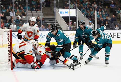 SAN JOSE, CA – SEPTEMBER 27: Mike Smith #41 and Travis Hamonic #24 of the Calgary Flames stop Rourke Chartier #60 and Marcus Sorensen #20 of the San Jose Sharks from scoring during their preseason game at SAP Center on September 27, 2018 in San Jose, California. (Photo by Ezra Shaw/Getty Images)