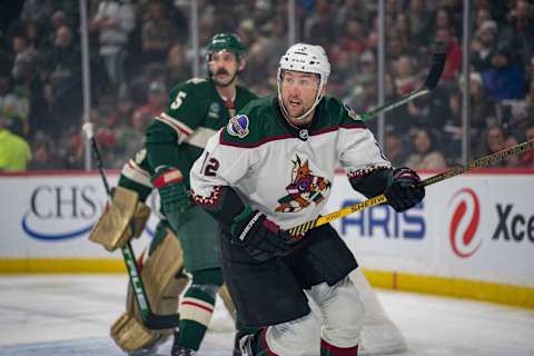 Jan 14, 2023; Saint Paul, Minnesota, USA; Arizona Coyotes left wing Nick Ritchie (12) and Minnesota Wild defenseman Jake Middleton (5) in the first period at Xcel Energy Center. Mandatory Credit: Matt Blewett-USA TODAY Sports