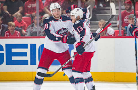 DETROIT, MI – OCTOBER 04: Cam Atkinson #13 of the Columbus Blue Jackets celebrates his first period goal with teammate Pierre-Luc Dubois #18 during an NHL game against the Detroit Red Wings at Little Caesars Arena on October 4, 2018 in Detroit, Michigan. (Photo by Dave Reginek/NHLI via Getty Images)