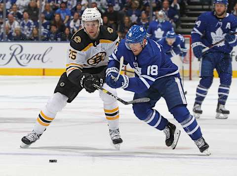 TORONTO, ON – APRIL 21: Brandon Carlo #25 of the Boston Bruins battles against Andreas Johnsson #18 of the Toronto Maple Leafs in Game Six of the Eastern Conference First Round during the 2019 NHL Stanley Cup Playoffs at Scotiabank Arena on April 21, 2019 in Toronto, Ontario, Canada. (Photo by Claus Andersen/Getty Images)