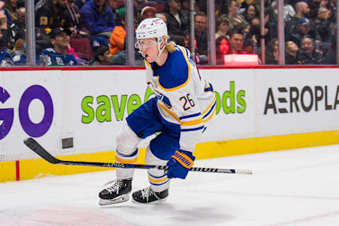 Mar 20, 2022; Vancouver, British Columbia, CAN; Buffalo Sabres defenseman Rasmus Dahlin (26) celebrates his game winning goal against the Vancouver Canucks at Rogers Arena. Sabres won 3-2 in overtime. Mandatory Credit: Bob Frid-USA TODAY Sports