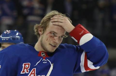 NEW YORK, NEW YORK – JANUARY 07: Ryan Lindgren #55 of the New York Rangers leaves the ice following a first period fight with Nazem Kadri #91 of the Colorado Avalanche at Madison Square Garden on January 07, 2020 in New York City. The Rangers defeated the Avalanche 5-3. (Photo by Bruce Bennett/Getty Images)