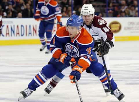 Mar 25, 2015; Edmonton, Alberta, CAN; Edmonton Oilers forward Taylor Hall (4) carries the puck in the Colorado Avalanche zone during the third period at Rexall Place. Mandatory Credit: Perry Nelson-USA TODAY Sports